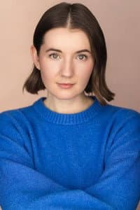 Nell Baker in The Grinner