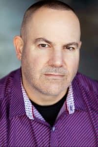 Darren W. Conrad in The Gospel According to Booze, Bullets, & Hot Pink Jesus, Act II: A Saint of Sin in a Den of Thieves