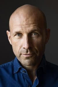 Adam Holm in En slatten sandhed