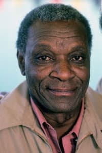 Moses Gunn in Amityville II: The Possession