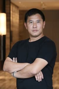 Bruce Law Lai-Yin in The Hero of Heroic Bloodshed: A John Woo Documentary